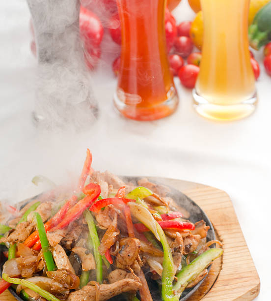 istock original fajita sizzling hot  on iron plate 177559893