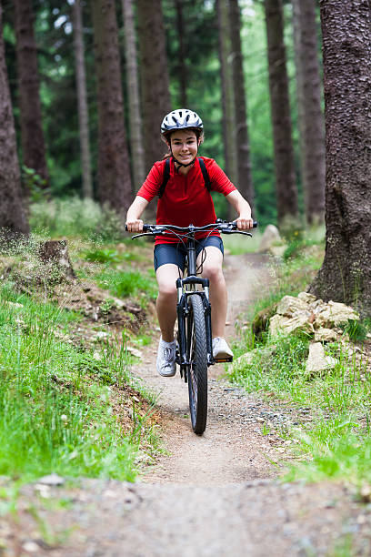 istock Girl riding bike in forest 177560942