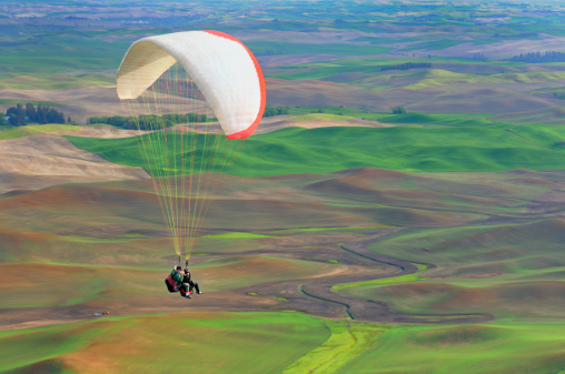 Two para-gliders flying tandem over the Palouse region of Washington state.Please see related images: