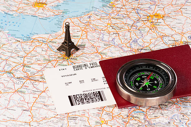 istock eiffel tower, compass and passport with boarding pass 177561151