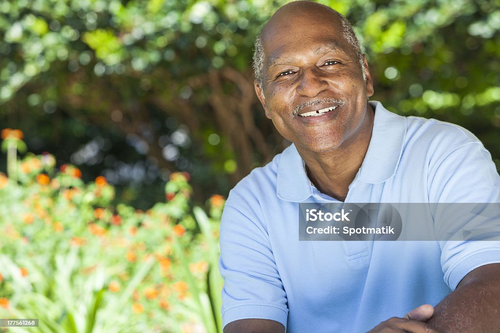 Happy Senior African American Man A happy senior African American man in his sixties outside smiling. African-American Ethnicity Stock Photo