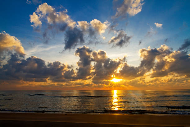 istock Sunrise on water in morning  at beach 1775638385