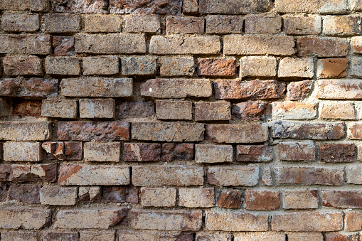 old brick wall background. Brickwork from an old brick in a rustic style