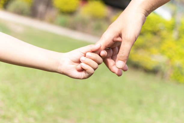 istock Mother and son holding hand. 1775682341