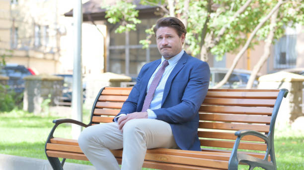 istock Middle Aged Businessman in Denial while Sititng Outdoor 1775690208