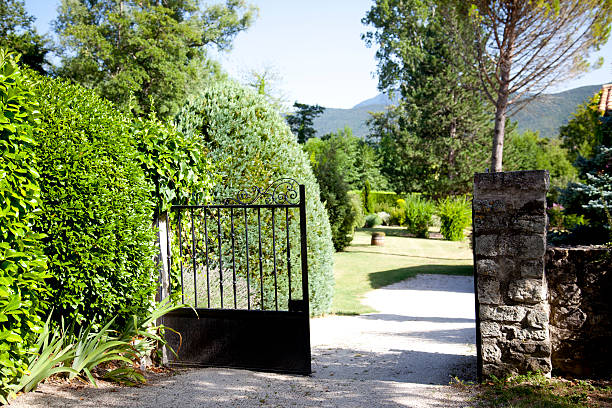 istock open gate leading to large garden 177571433