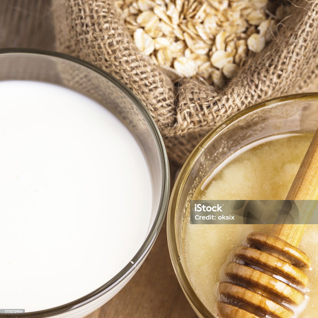 Milk and honey Milk and honey on the wooden table closeup Alternative Therapy Stock Photo