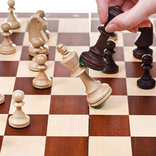 istock black king overturns white in chess game 177574261