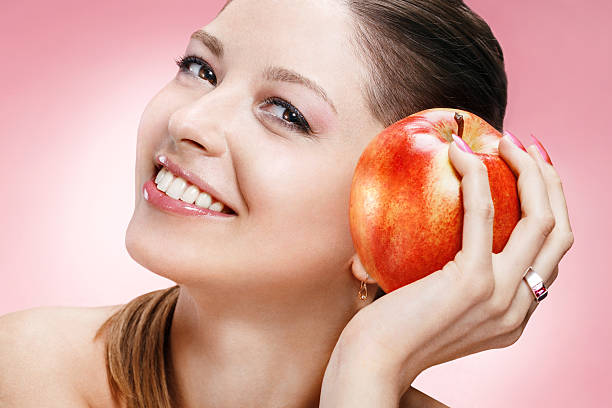 istock Young beautiful girl with apple 177577966