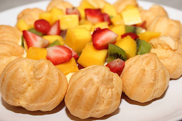 Asia Tasty fruity tartlets or cake with fresh milk cream cheese and different berries in cafe