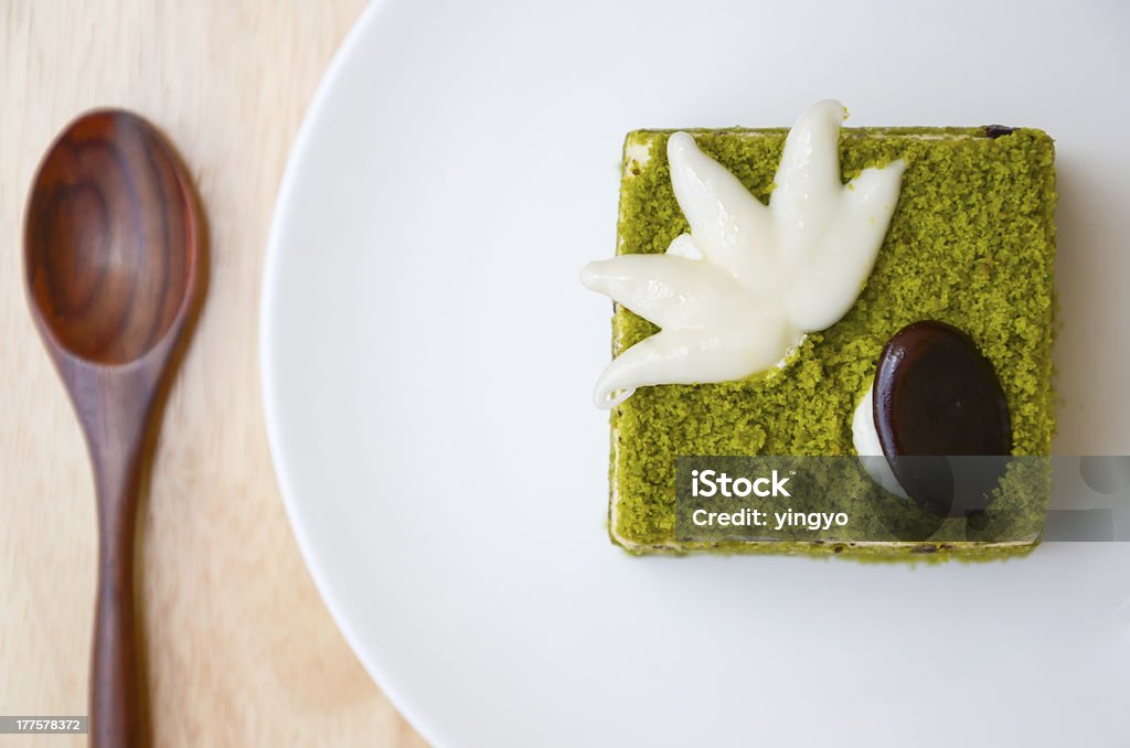 Matcha Chocolate Chip Cake. Matcha Chocolate Chip Cake and spoon on wooden table. Asian Culture Stock Photo