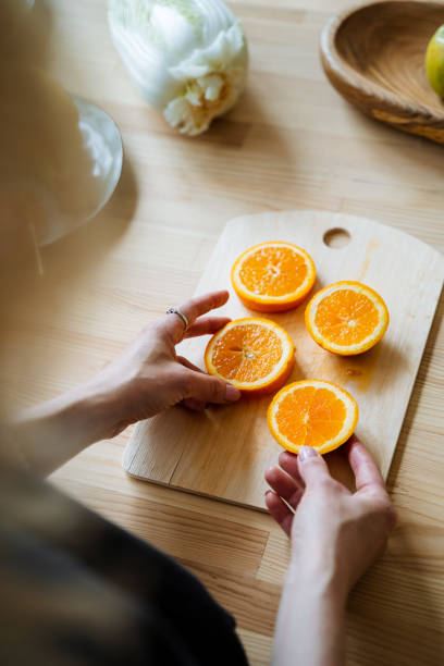 istock young white girl holding fruit in her hands, fruit on the table 1775787671