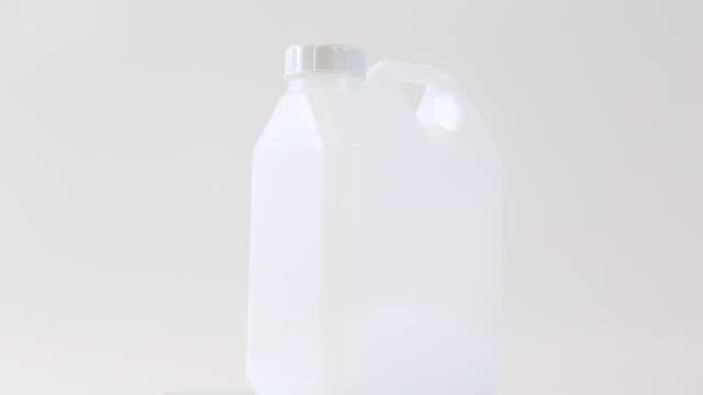 white plastic gallon, white background