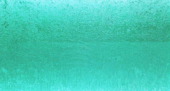 shiny bright green fabric wallpaper looks like metal use as background texture for luxury, rich mood and tone. blue glitter texture background sparkling shiny wrapping paper for decoration.