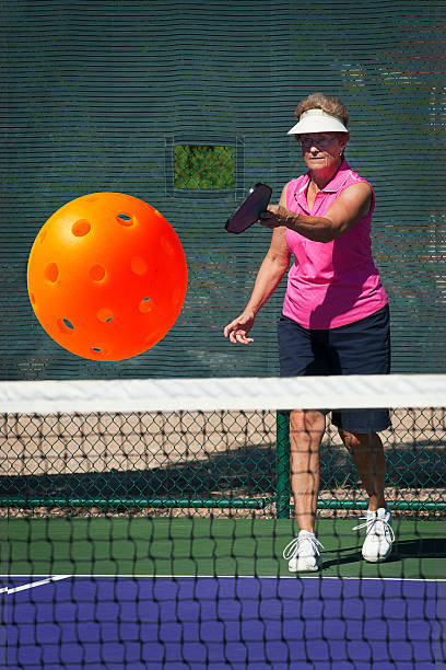 istock Senior Woman Serving Pickleball 177583877