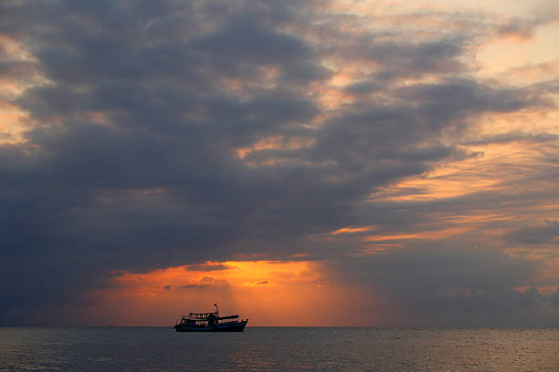 istock Sunbeam with fishing boat 177585378