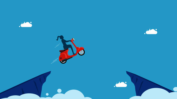 istock Determined to overcome obstacles. woman drives a motorcycle and jumps over a gap in a cliff 1775870917