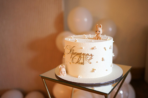 Festive cake with the inscription Baptism and a figure of a hare.