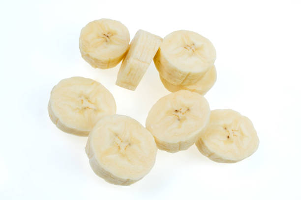 istock Flying banana slices, isolated on white background. 1775901283