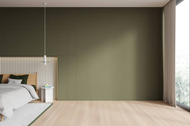 istock Green hotel bedroom interior with bed and mock up wall, panoramic window 1775901807
