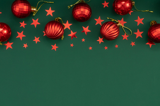 Red christmas balls and pine cones isolated on snow, Christmas banner