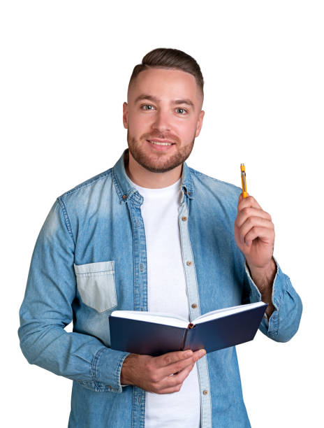istock Cheerful man college student with notebook and pen, isolated 1775910181