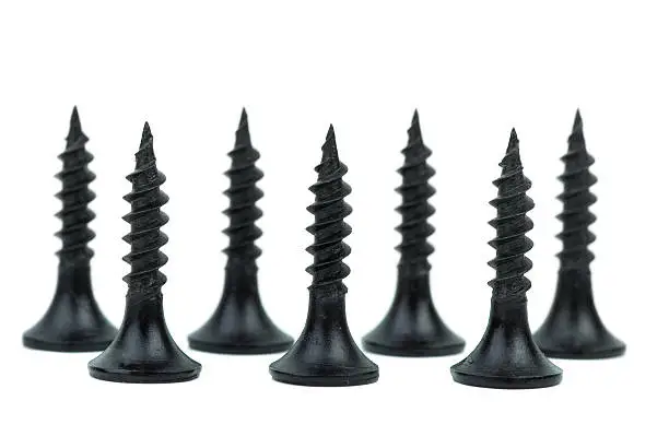 Standing metal screws isolated on the white background