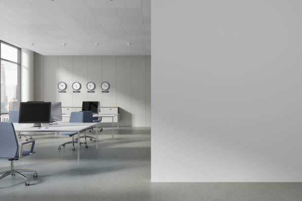 istock Cozy coworking interior with technology, world clock and window. Mock up wall 1775915061