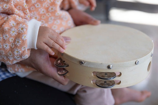 Child's hands in the living room closeup. High quality photo. 02.17.2023