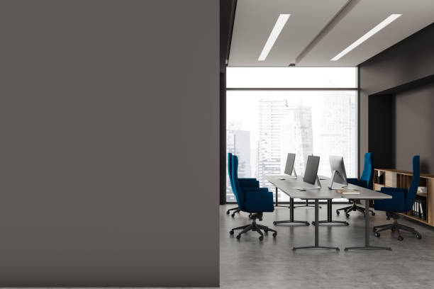 istock Stylish office interior with pc desktop and drawer, window. Mock up wall 1775916715