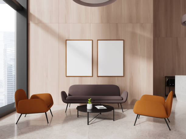 istock Light wooden office waiting room with sofa and posters 1775917238