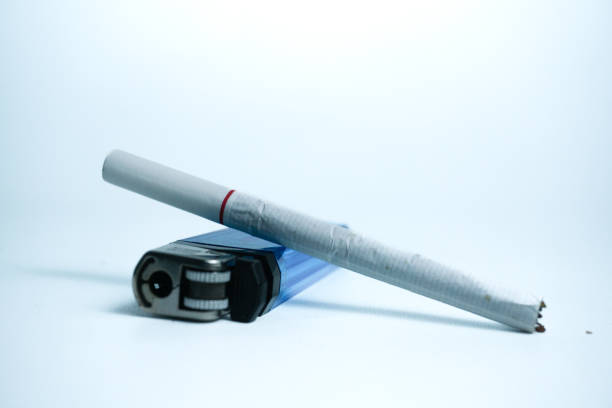 istock cigarette, and a steel gas lighter. isolated on white 1775919984