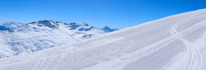 Perfect ski slope.  High mountain  landscape  At the top. Italian Alps  ski area. Panoramic  Ski resort Livigno. italy, Europe. Ski opening.