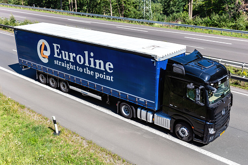 Wiehl, Germany - June 26, 2020: Mercedes-Benz Actros truck with Euroline curtainside trailer on motorway