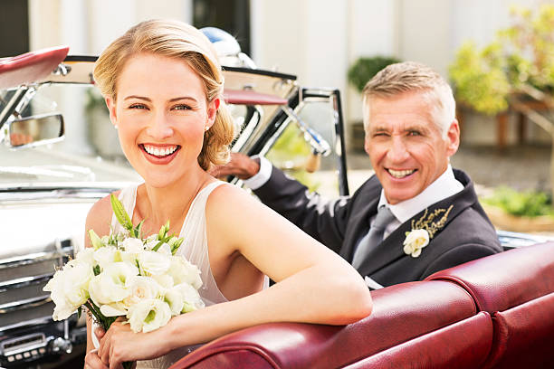 istock Happy Bride And Father Sitting In Convertible 177594478