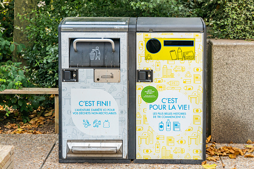 Trash bin containers for sorting recyclable and non-recyclable waste in Paris, France