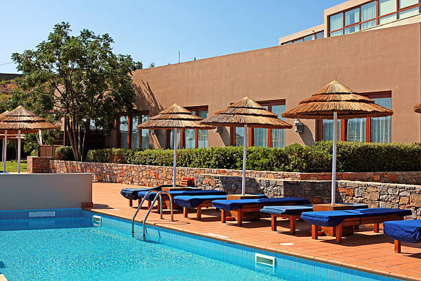 istock poolside with pool bed and umbrella in summer resort 177596481