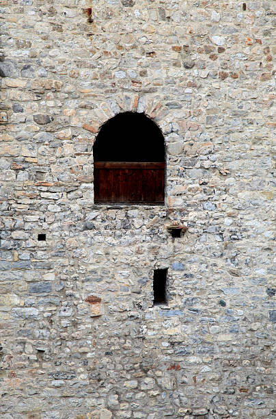 istock window in old stone  wall of medieval castle 177599015