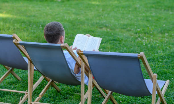istock Reading books on vacation outdoors 1775993998