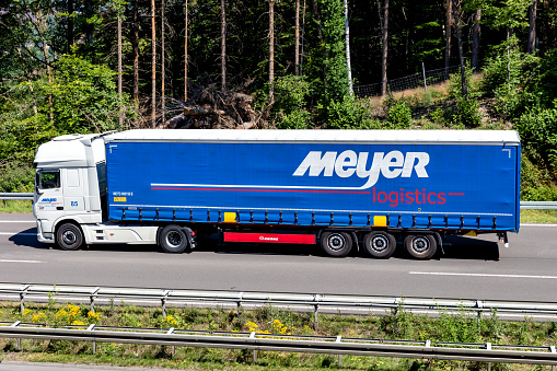 Wiehl, Germany - June 26, 2020: Meyer Logistics DAF XF truck with curtainside trailer on motorway