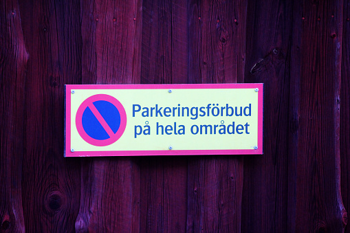 A Swedish sign saying : you are not allowed to park in all of this entire area