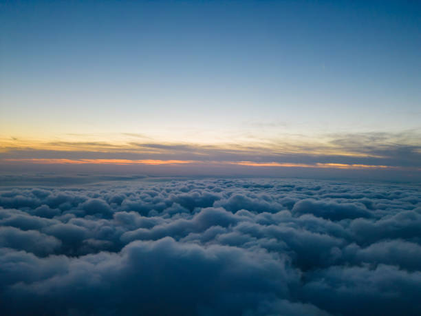 istock A drone flies over fluffy clouds at sunset. The drone flies through the clouds, creating a sense of wonder and awe 1776010584
