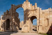 Jordan, Gerasa (Jerash) is ancient city that is six and half thousand years old. South gate of city. Ruins of well-preserved monumental building with three arches.