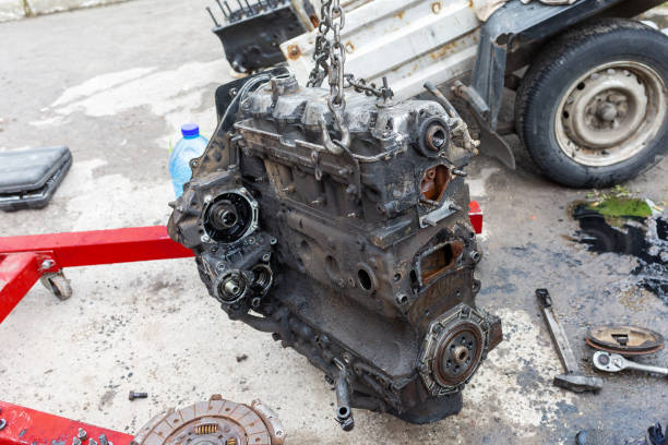 istock The car's internal combustion engine hangs on chains during repairs. 1776059643