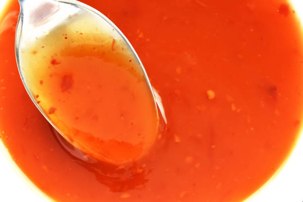istock Sweet and chilli sauce on spoon. 1776090488