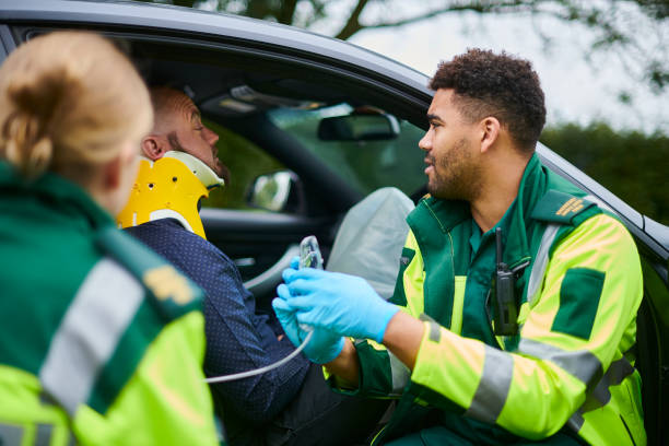 istock paramedics administering oxygen at car crash 1776100165