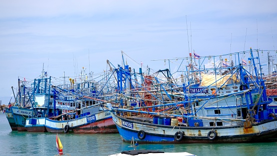 Rayong, Thailand - September, 25 2023 : Colorful Thai tradition wooden fishing boats at Ban Phe pier.