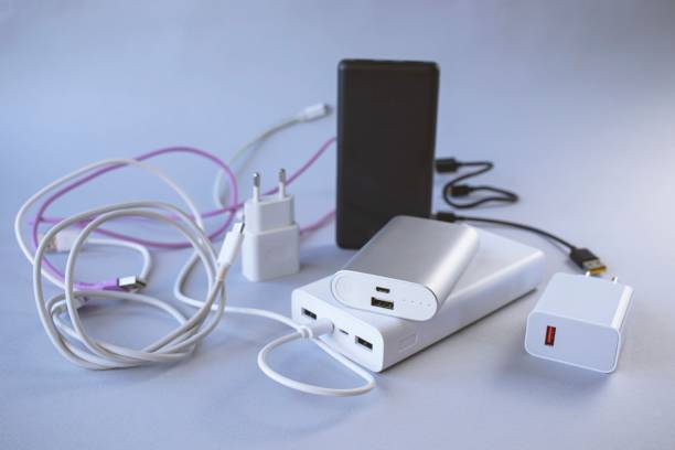 istock Power bank, external battery and usb wire on the table, universal mobile battery 1776122675