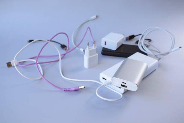 istock Power bank, external battery and usb wire on the table, universal mobile battery 1776123766