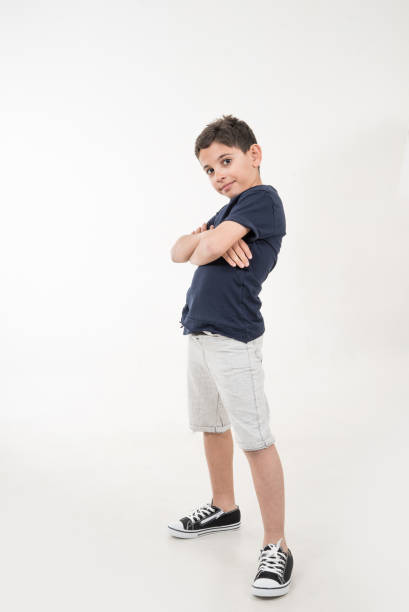 boy is on white background and he is huging vertical still